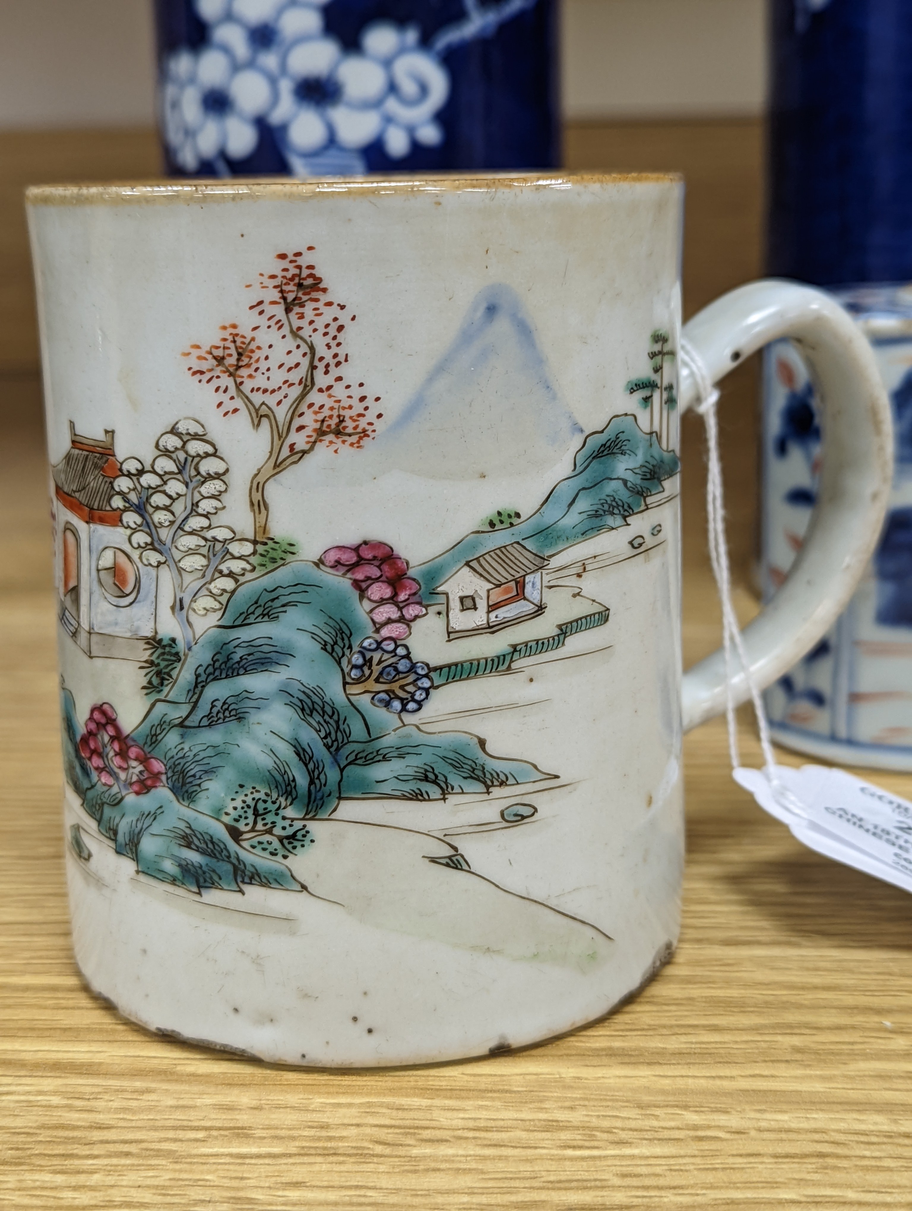 An 18th century Chinese famille rose mug, a Chinese Imari tea caddy and two Chinese blue and white sleeve vases 30cm (4)